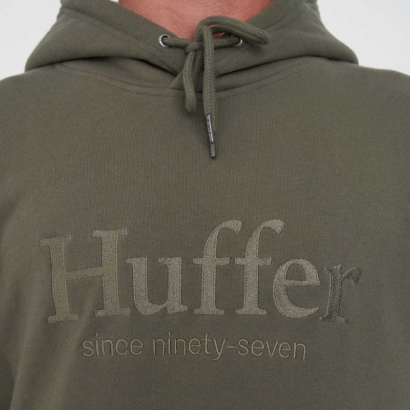 Green hoodie with 'Huffer' branding on a plain background