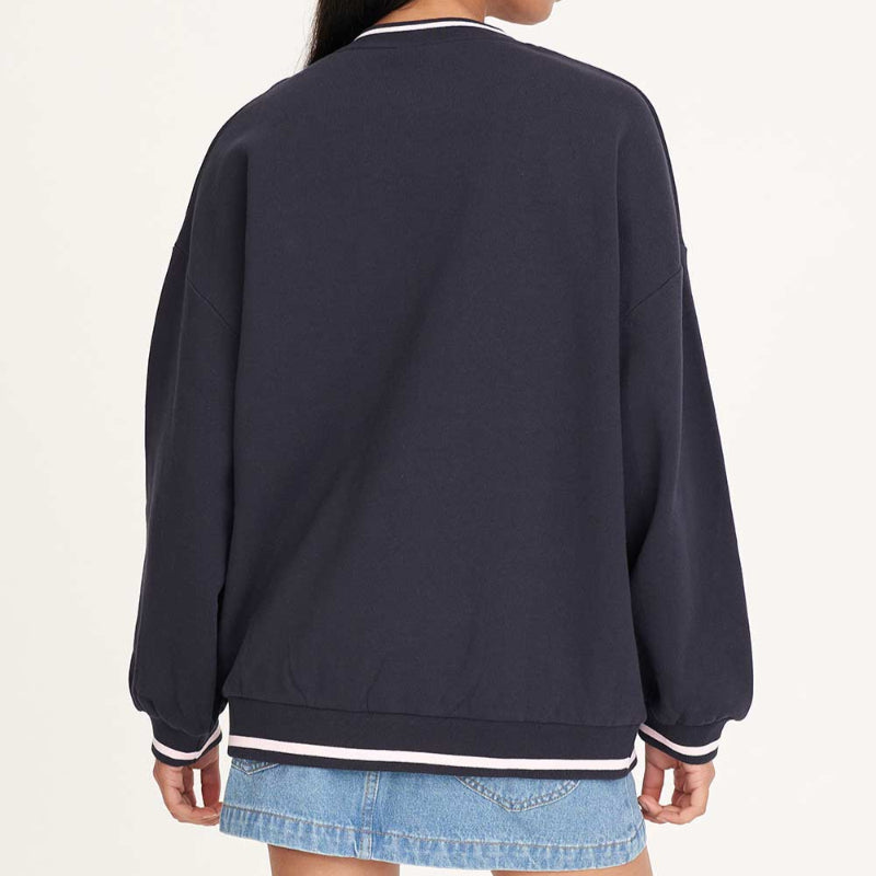 Person wearing a navy blue sweatshirt on a white background