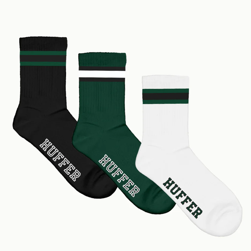 Three socks in black, green, and white with 'Huffer' branding on a white background
