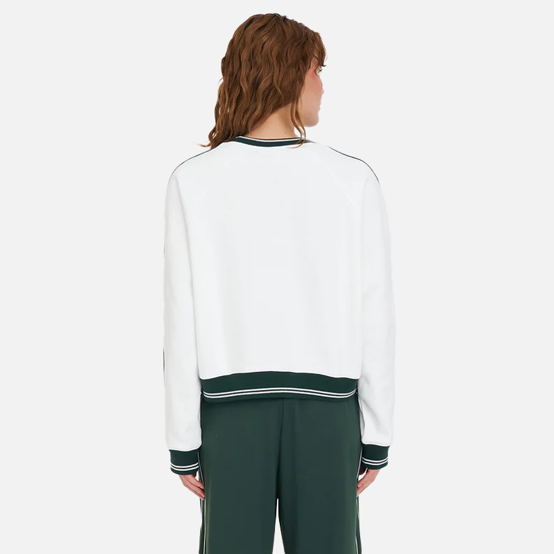 Person wearing a white and green tracksuit on a plain background