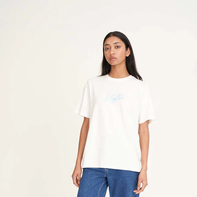 Person wearing a white t-shirt and blue jeans on a white background