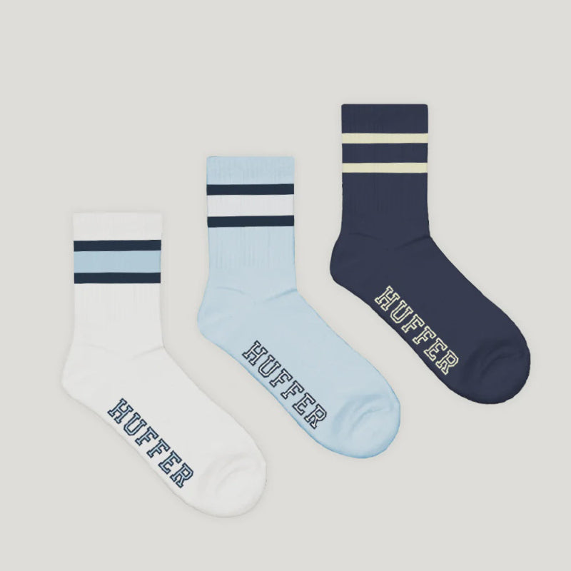 Three pairs of socks with 'Huffer' branding on a light gray background