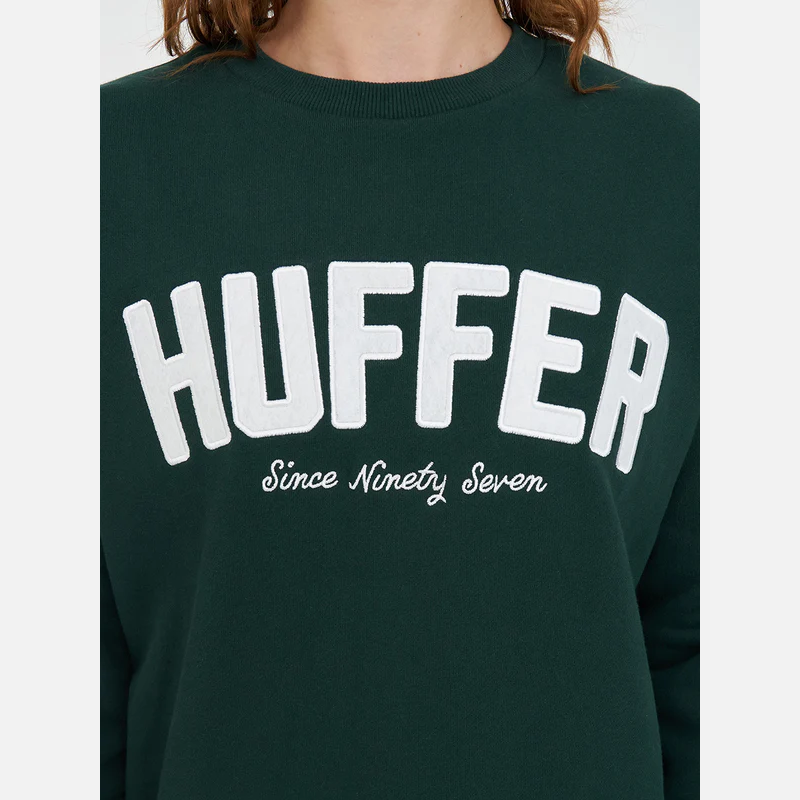 Green sweatshirt with 'HUFFER Since Ninety Seven' text on a white background