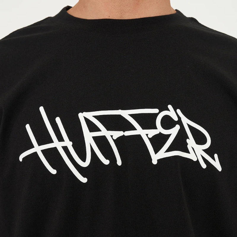Black t-shirt with white 'Huffer' logo on a plain background