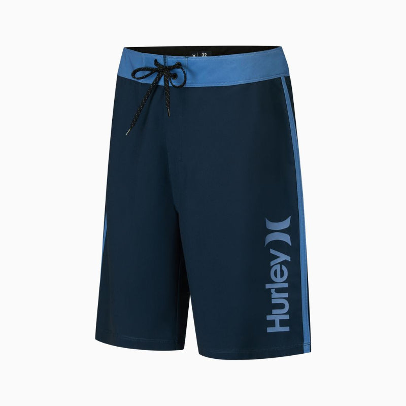 Navy blue Hurley board shorts with a light blue waistband and side stripe, featuring a white vertical Hurley logo on the lower left leg.