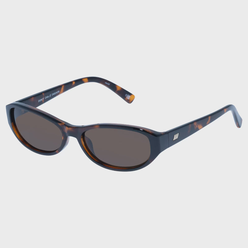 Sunglasses with tortoiseshell frame and dark lenses on a white background
