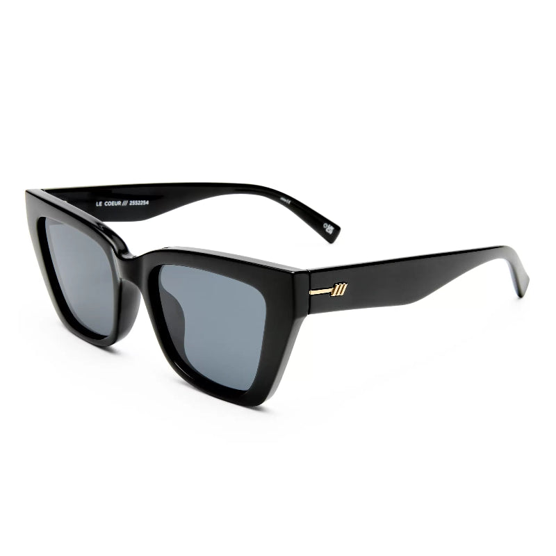 Black square sunglasses with gray lenses and a small gold logo detail on the temple, shown on a white background.