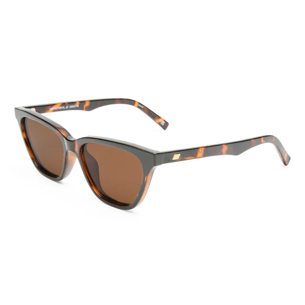 Sunglasses with tortoiseshell frame and brown lenses on a white background