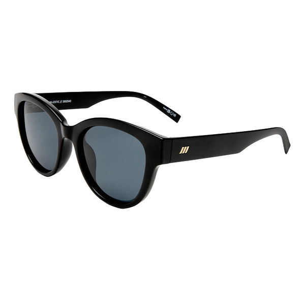 Black cat-eye sunglasses with dark gray lenses and a small gold logo on the temple, shown on a plain white background.