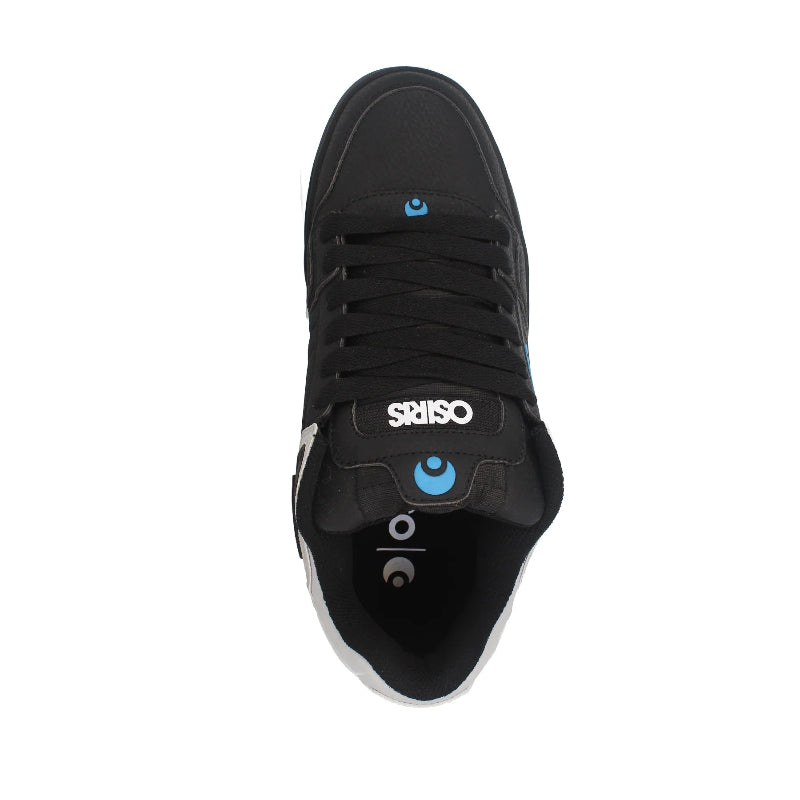 Black sneaker with visible branding on a white background