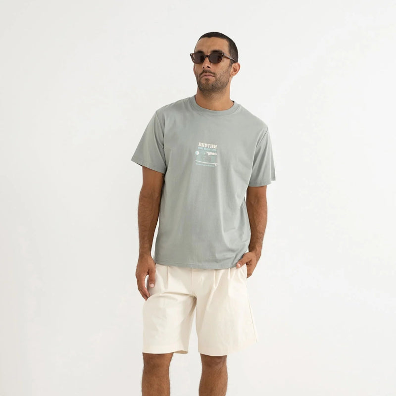Man wearing a gray t-shirt and white shorts on a white background