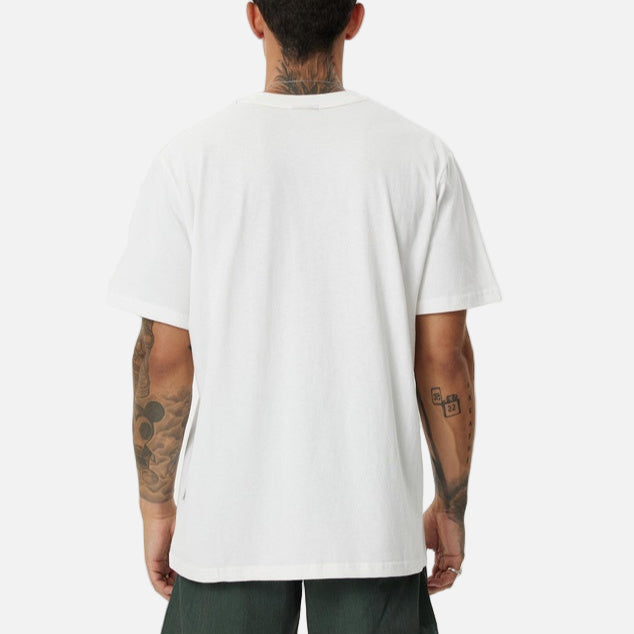 Person wearing a white t-shirt and green shorts on a white background