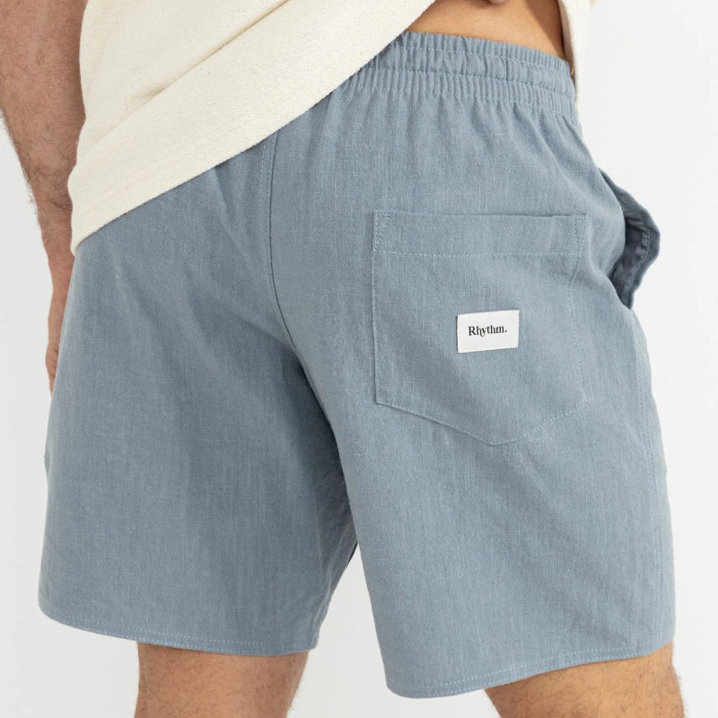 Light blue shorts with a brand logo on a white background