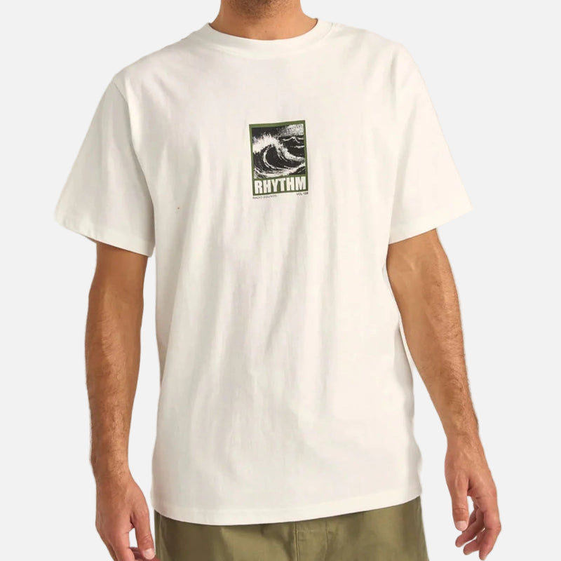 Man wearing a white t-shirt with a logo on a plain background