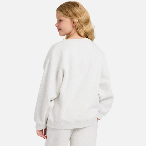 Person wearing a light gray sweatshirt on a white background