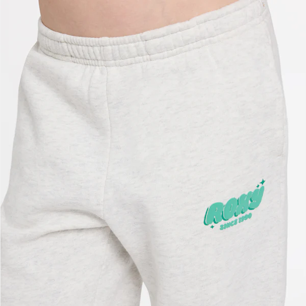 White sweatpants with a green logo on a white background