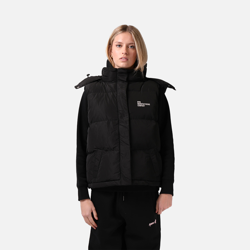 Person wearing a black puffer vest with a brand logo on a white background