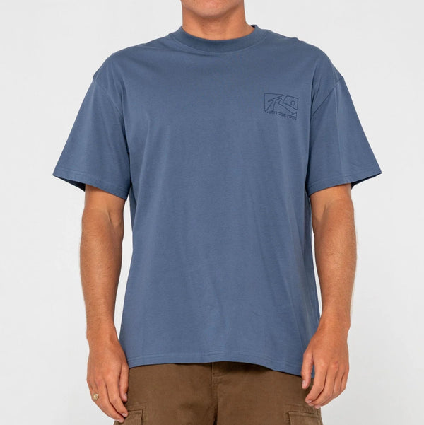 Man wearing a blue t-shirt with a logo on a white background