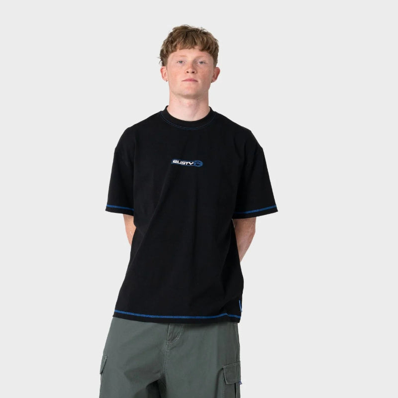 Person wearing a black t-shirt with a logo and green shorts on a white background