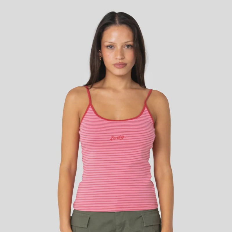 Woman wearing a pink striped tank top and green shorts on a white background