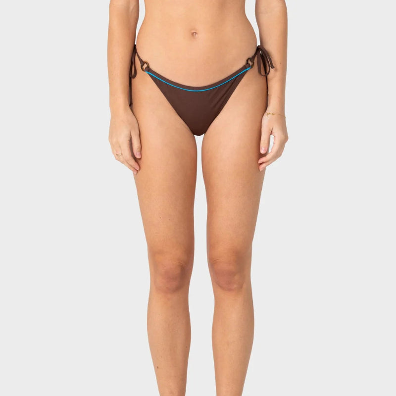 A model wearing a pair of dark brown string bikini bottoms with a thin teal blue trim, shown from the waist down against a light gray background.