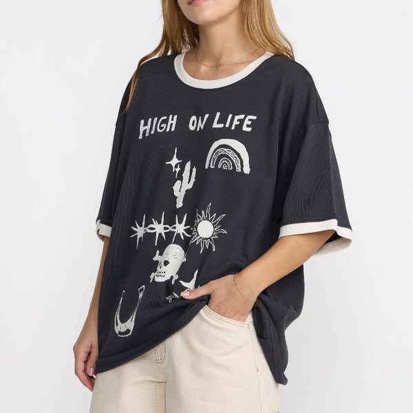 Woman wearing a black t-shirt with graphic designs and text on a white background