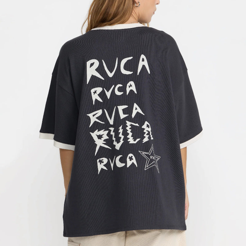Person wearing a black t-shirt with 'RVCA' branding on the back against a white background