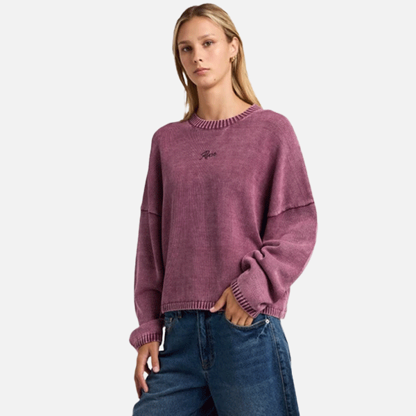 a women wearing a pink sweeter 