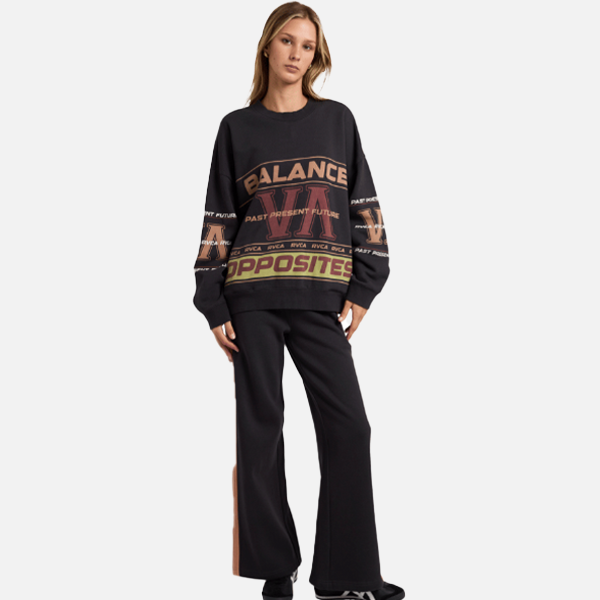 Person wearing a black sweater with text and logo design on a white background