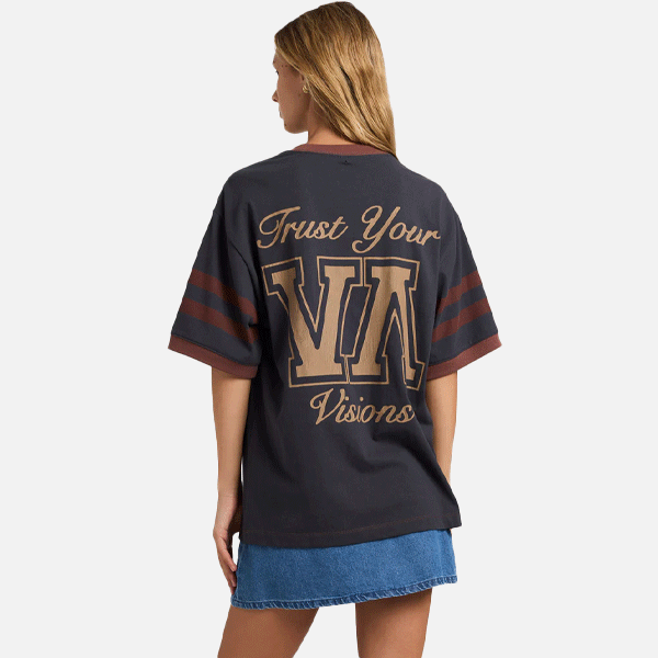 a women wearing a black and brown t-shirt with a big logo on the front