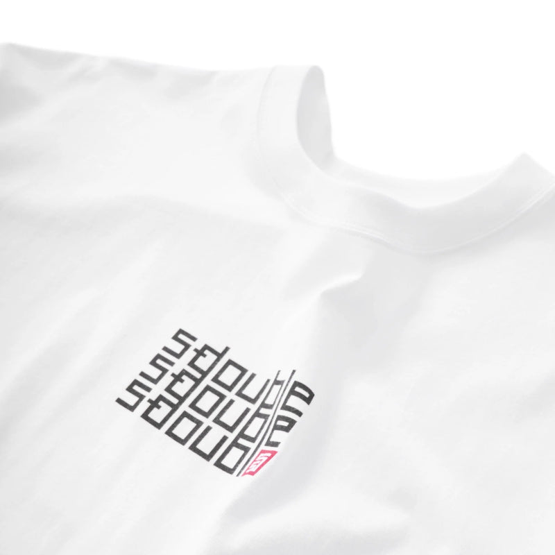 Close-up of a white short-sleeve T-shirt with a black geometric logo and a small pink accent on the left chest.