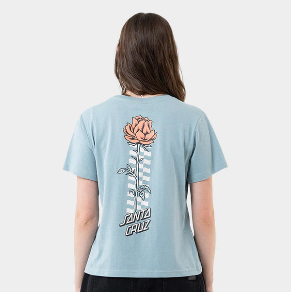 Person wearing a light blue t-shirt with a floral design on the back, standing against a plain background.