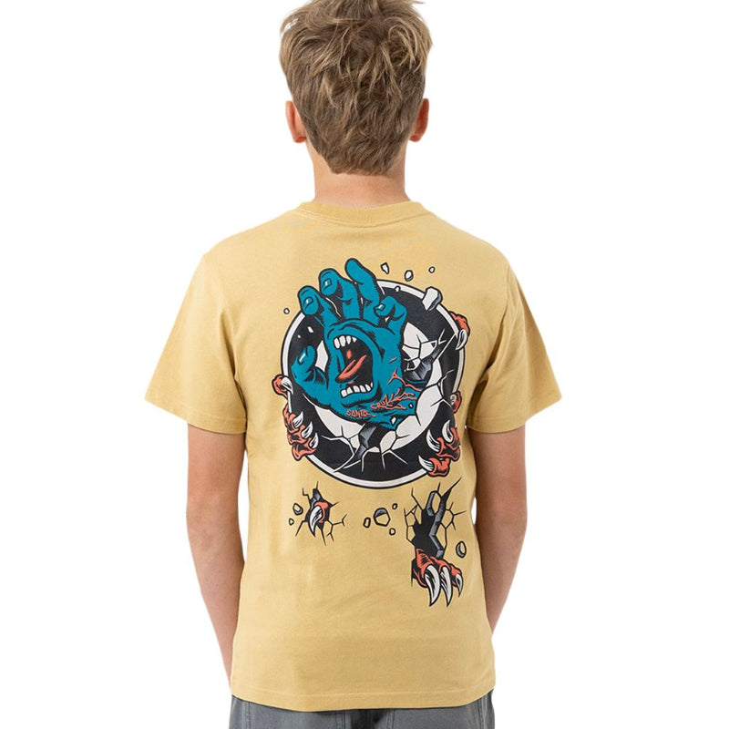 A child viewed from behind wearing a light tan t-shirt with a large blue monster graphic on the back, paired with gray shorts featuring a matching graphic.