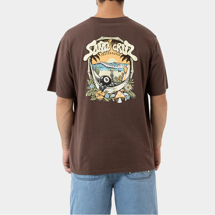 Person wearing a brown t-shirt with a graphic design on the back, standing against a plain background