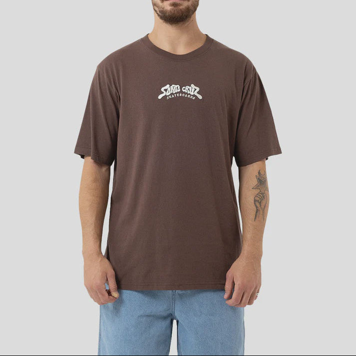 Man wearing a brown t-shirt with a logo on a plain background