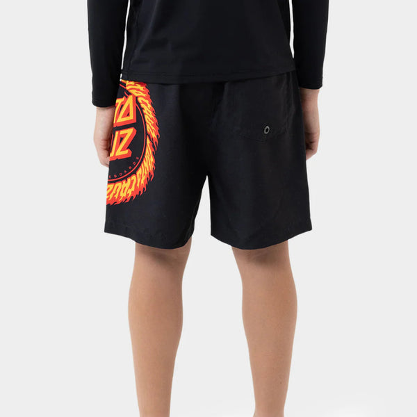 Person wearing black shorts with a colorful design on a white background