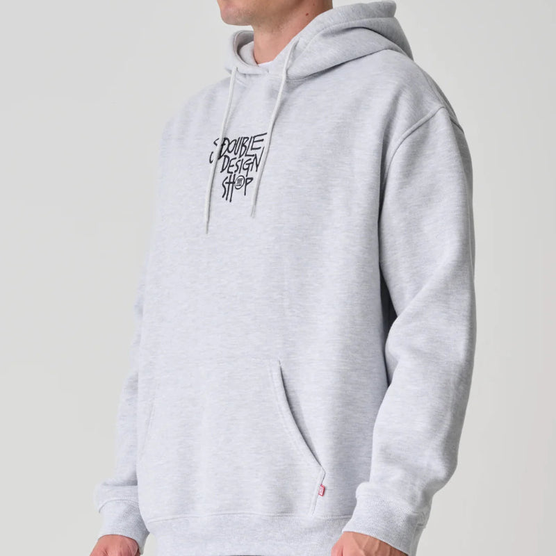 Person wearing a gray hoodie with a logo on a plain background