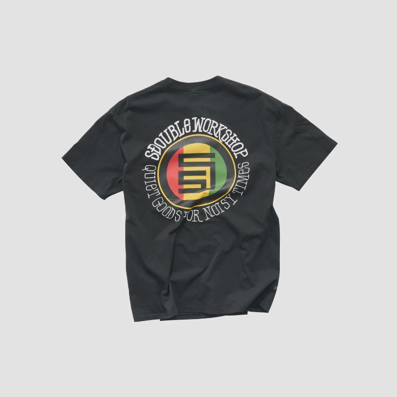 A black short-sleeve t-shirt with a large circular graphic on the back, featuring the text 'SDOUBLE WORKSHOP' ain white around a red, yellow, and green circular emblem with a stylized 'GM' logo.