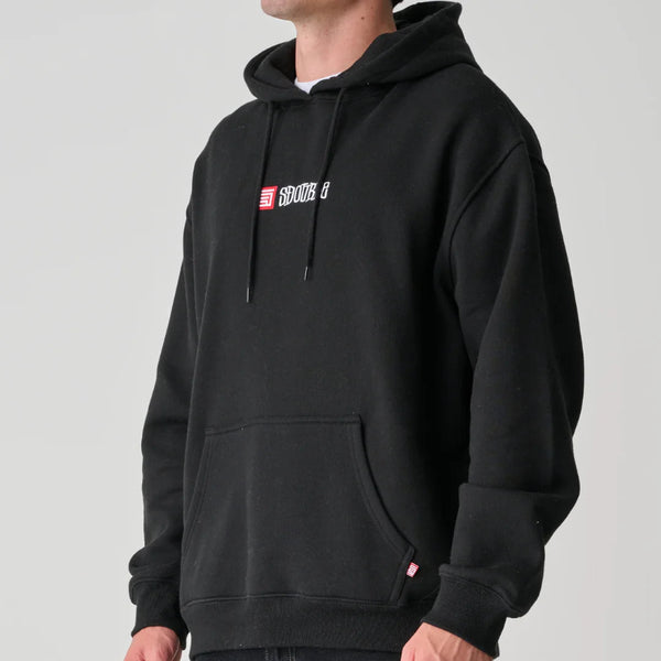 Person wearing a black hoodie with a logo on a gray background