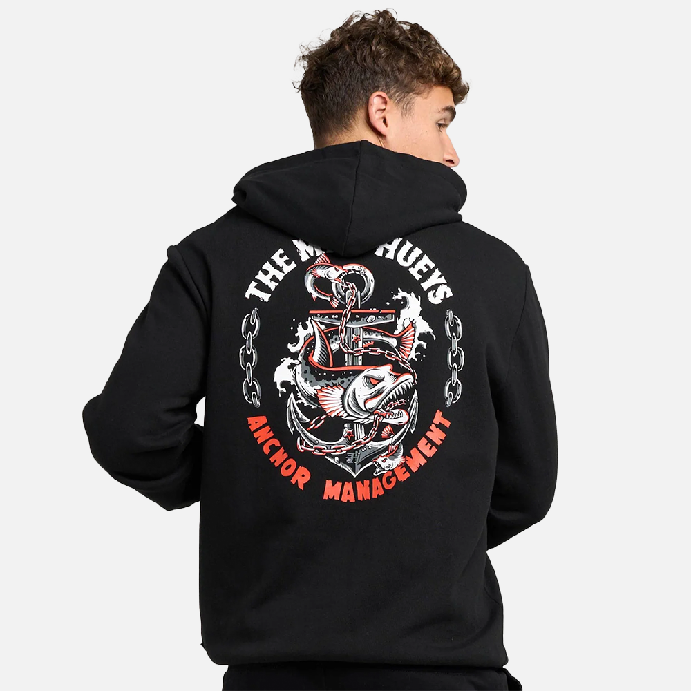 Person wearing a black hoodie with a graphic design on the back against a white background