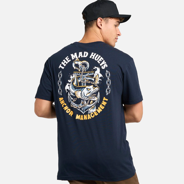 Person wearing a navy blue t-shirt with 'The Mad Hueys' graphic design on the back.