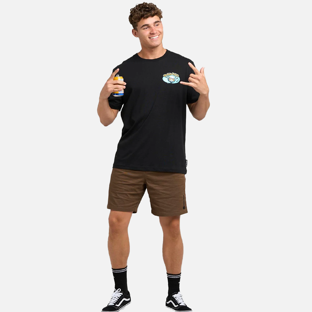 Man wearing a black t-shirt with a logo, brown shorts, and black sneakers on a white background