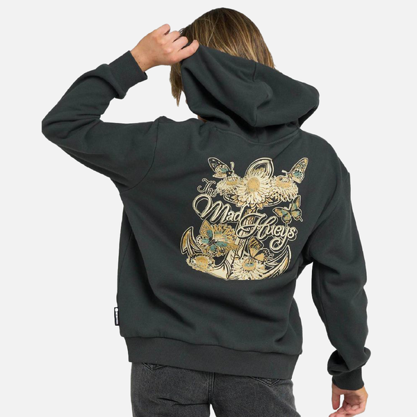 Person wearing a dark hoodie with a floral and butterfly design on the back, on a white background