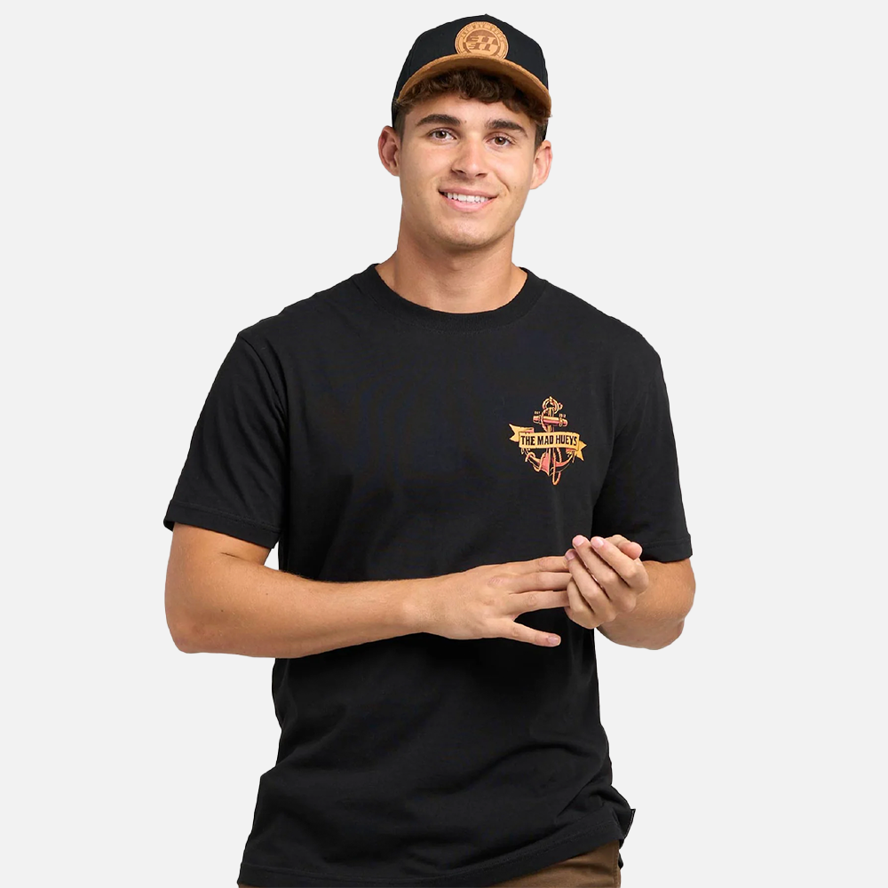 Man wearing a black t-shirt with a logo and a cap on a white background