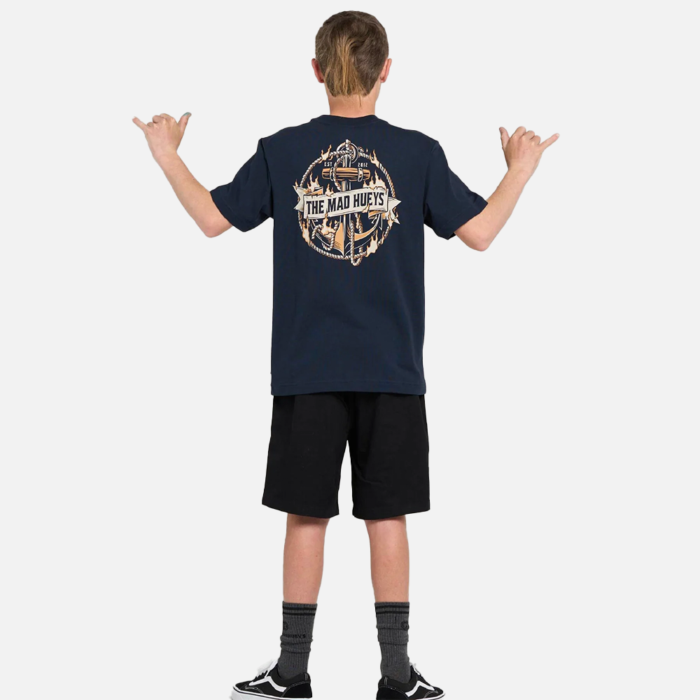Person wearing a navy blue t-shirt with a graphic design on the back, standing against a white background.