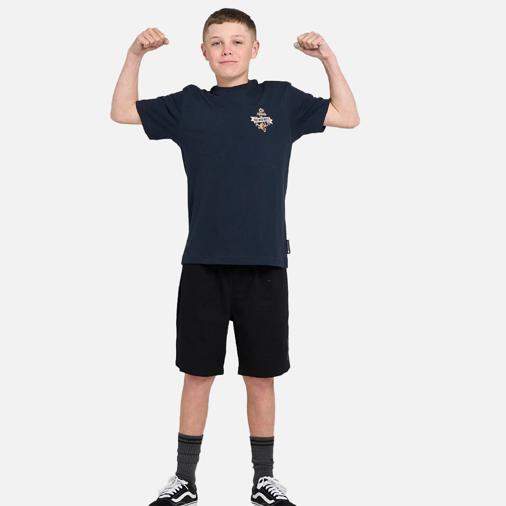 Child wearing a navy blue t-shirt and black shorts on a white background
