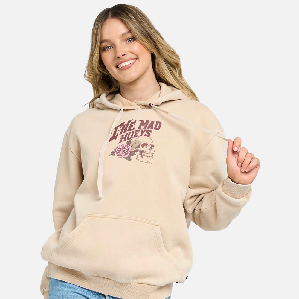Woman wearing a beige hoodie with a logo and text on a white background