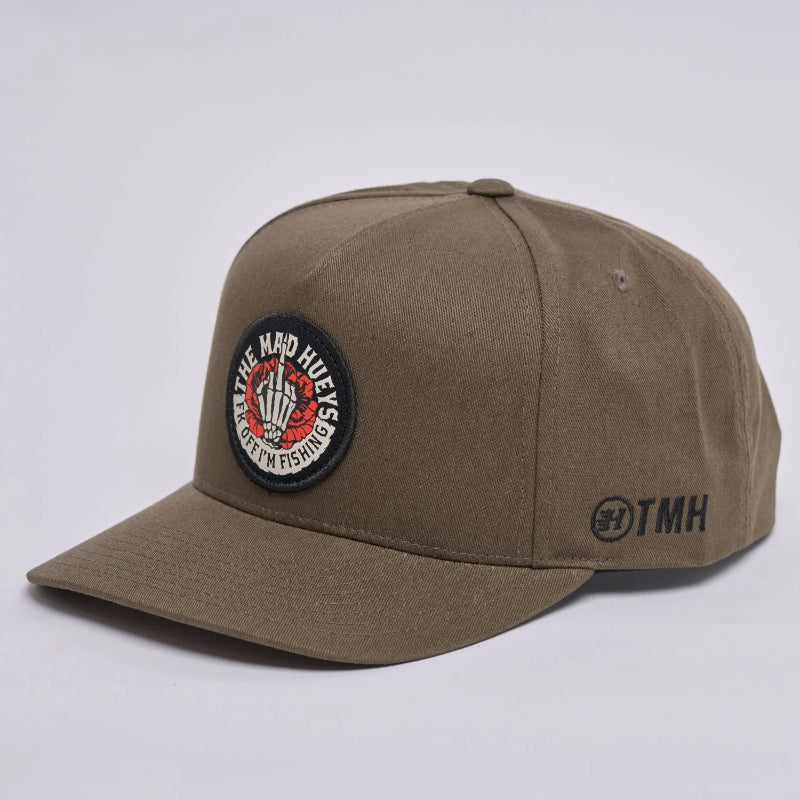 olive green cap with a black logo on a white background