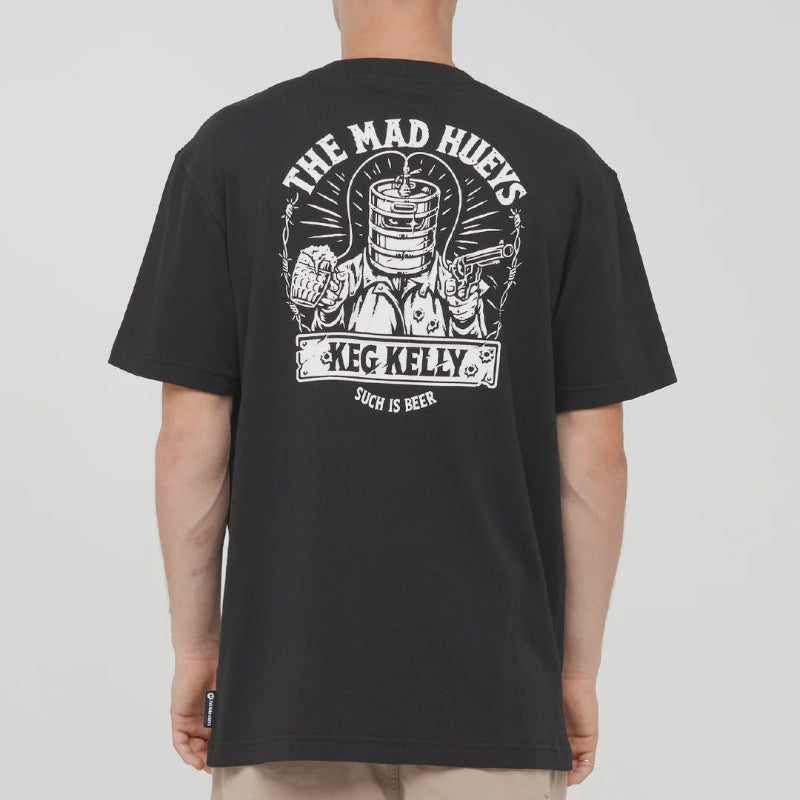 A man viewed from the back wearing a black t-shirt with a large white graphic print on the back. The graphic features a keg, a beer glass, and the text 'THE MAD HUEYS', 'KEG KELLY.