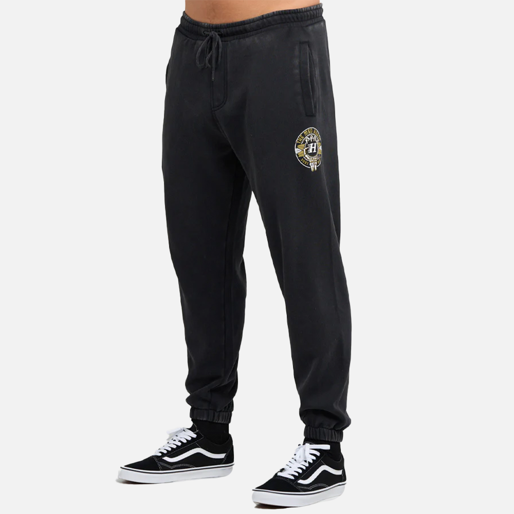 Black sweatpants with a logo on the left leg against a white background